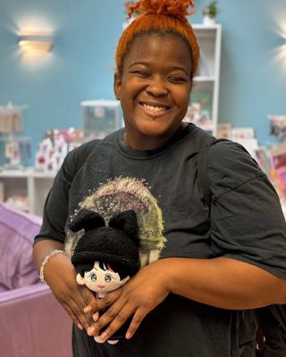 Happy customer with a Kpop plushie